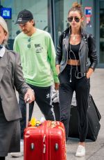 ELEANOR CALDER and Louis Tomlinson at Heathrow Airport 08/28/2019