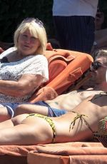 HEIDI KLUM in Bikini at a Pool in Capri 07/29/2019