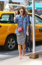 KATIE HOLMES Leaves a Cab in New York 08/18/2019