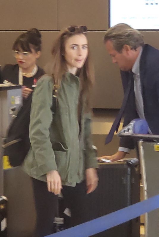 LILY COLLINS at Los Angeles International Airport 08/03/2019