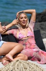 MEGAN BARTON HANSON and DEMI SIMS in Bikinis at Celebs Go Dating Show Set in Crete 07/31/2019