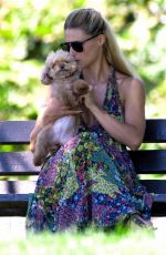 MICHELLE HUNZIKER and Tomaso Trussardi with Their Dog at a Park in Bergamo 08/03/2019