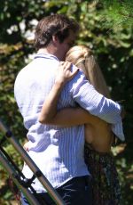 MICHELLE HUNZIKER and Tomaso Trussardi with Their Dog at a Park in Bergamo 08/03/2019