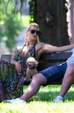 MICHELLE HUNZIKER and Tomaso Trussardi with Their Dog at a Park in Bergamo 08/03/2019