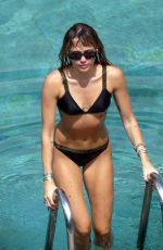 MILEY CYRUS and KAITLYNN CARTER in Bikinis at a Pool in Italy 08/11/2019
