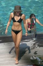 MILEY CYRUS and KAITLYNN CARTER in Bikinis at a Pool in Italy 08/11/2019