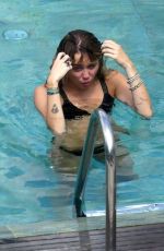 MILEY CYRUS and KAITLYNN CARTER in Bikinis at a Pool in Italy 08/11/2019
