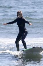 REESE WITHERSPOON Surfing at Malibu Beach 09/02/2019