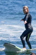 REESE WITHERSPOON Surfing at Malibu Beach 09/02/2019