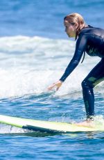 REESE WITHERSPOON Surfing at Malibu Beach 09/02/2019