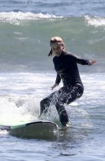 REESE WITHERSPOON Surfing at Malibu Beach 09/02/2019
