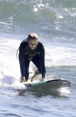 REESE WITHERSPOON Surfing at Malibu Beach 09/02/2019