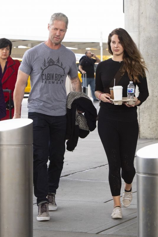 LANA DEL REY and Sean Larkin at JFK Airport in New York 10/25/2019