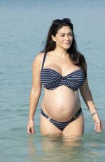 Pregnant CASEY BATCHELOR in Bikini on the Beach in Dubai 10/15/2019