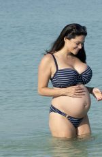 Pregnant CASEY BATCHELOR in Bikini on the Beach in Dubai 10/15/2019