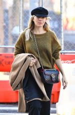 SIENNA MILLER in a Green Sweater Out in New York 10/23/2019