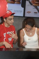 KATIE HOLMES Takes Donations at McDonald