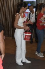 KATIE HOLMES Takes Donations at McDonald