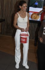 KATIE HOLMES Takes Donations at McDonald