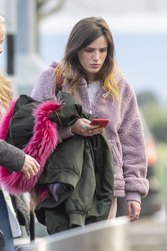 BELLA THORNE at Heathrow Airport in London 12/03/2019