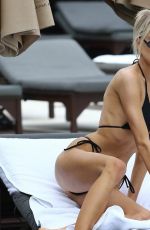 CHARLOTTE MCKINNEY in Bikini at a Beach in Miami 12/07/2019