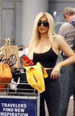 CHLE FERRY Grabbing Her Luggage at Airport in Norway 12/29/2019