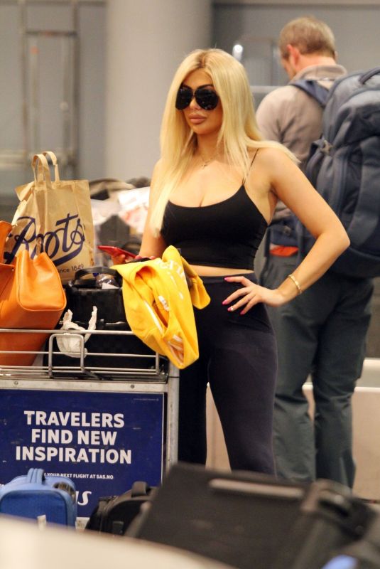 CHLE FERRY Grabbing Her Luggage at Airport in Norway 12/29/2019