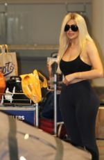 CHLE FERRY Grabbing Her Luggage at Airport in Norway 12/29/2019