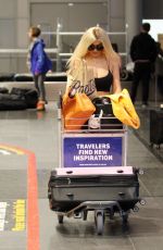 CHLE FERRY Grabbing Her Luggage at Airport in Norway 12/29/2019