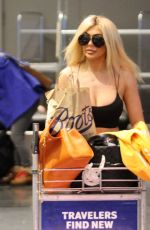 CHLE FERRY Grabbing Her Luggage at Airport in Norway 12/29/2019