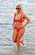 CHLOE FERRY in a Red Bikini on the Beach in Dubai 10/17/2019