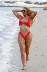 CHLOE FERRY in a Red Bikini on the Beach in Dubai 10/17/2019