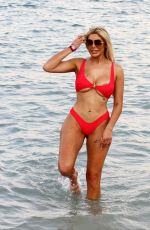 CHLOE FERRY in a Red Bikini on the Beach in Dubai 10/17/2019