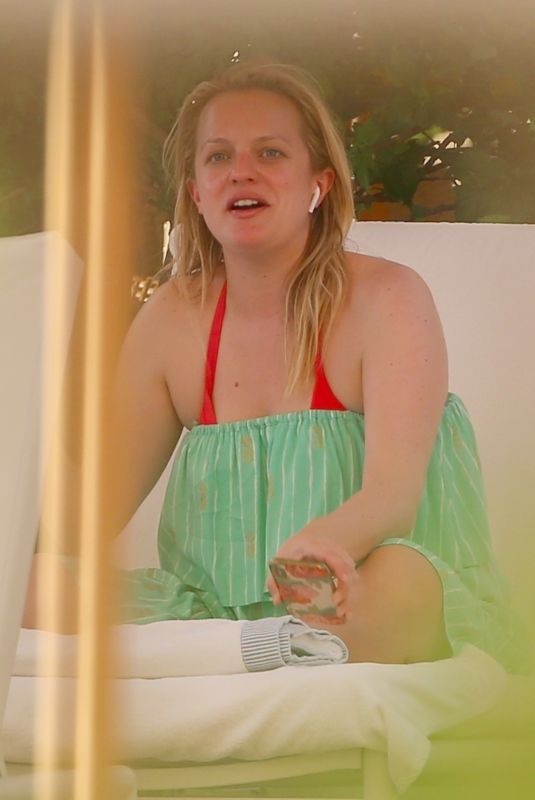 ELISABETH MOSS on the Set of Next Goal Wins at a Beach in Oahu 12/16/2019