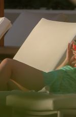 ELISABETH MOSS on the Set of Next Goal Wins at a Beach in Oahu 12/16/2019