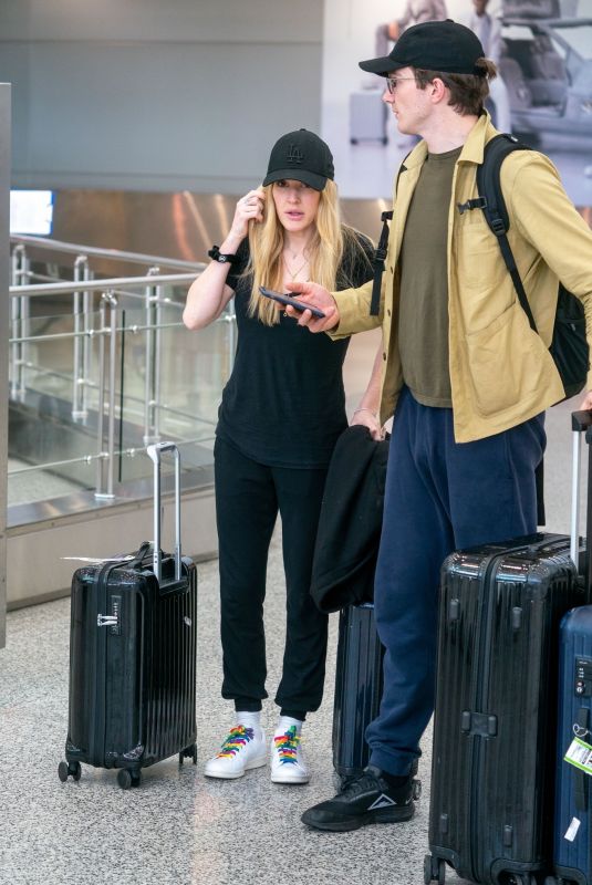 ELLIE GOULDING and Caspar Jopling at Miami International Airport 12/29/2019