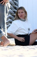 KATE MOSS on the Set of a Photoshoot on the Beach in Miami 12/04/2019