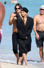 KATE MOSS on the Set of a Photoshoot on the Beach in Miami 12/04/2019