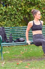 KATIE WAISSEL Works Out at a Park a London 12/28/2019