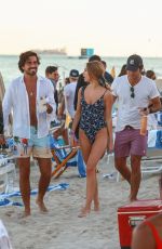 KIMBERLEY GARNER in Swimsuit on the Beach in Miami 12/06/2019