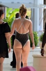 RHEA DURNHAM in Black Swimsuit at a Beach in Barbados 12/29/2019