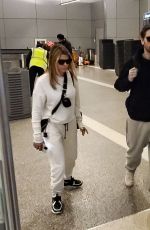 SOFIA RICHIE and Scott Disick at LAX Airport in Los Angeles 12/21/2019