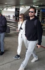 SOFIA RICHIE and Scott Disick at LAX Airport in Los Angeles 12/21/2019