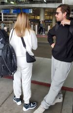 SOFIA RICHIE and Scott Disick at LAX Airport in Los Angeles 12/21/2019