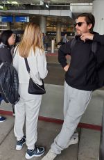 SOFIA RICHIE and Scott Disick at LAX Airport in Los Angeles 12/21/2019