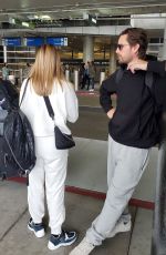 SOFIA RICHIE and Scott Disick at LAX Airport in Los Angeles 12/21/2019