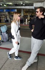 SOFIA RICHIE and Scott Disick at LAX Airport in Los Angeles 12/21/2019