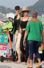 ASHLEY BENSON and CARA DELEVINGNE Out on Copacabana Beach in Rio De Janeiro 01/04/2020