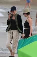 ASHLEY BENSON and CARA DELEVINGNE Out on Copacabana Beach in Rio De Janeiro 01/04/2020