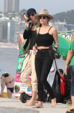 ASHLEY BENSON and CARA DELEVINGNE Out on Copacabana Beach in Rio De Janeiro 01/04/2020